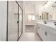 Bright bathroom showcasing a glass enclosed shower and double sink vanity with black hardware at 18759 E Panchito Dr, Gold Canyon, AZ 85118