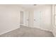 Bright bedroom with plush carpeting and closet, and a view of landing at 18759 E Panchito Dr, Gold Canyon, AZ 85118