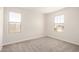 This bedroom features neutral carpet, and two windows for natural light at 18759 E Panchito Dr, Gold Canyon, AZ 85118