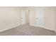 Bright bedroom with plush carpeting and closet, and a view of landing at 18759 E Panchito Dr, Gold Canyon, AZ 85118