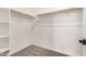 Walk-in closet with wood racks for hanging clothes and shelves for storage at 18759 E Panchito Dr, Gold Canyon, AZ 85118
