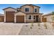 Lovely home with brown garage doors, desert landscaping, and charming facade at 18759 E Panchito Dr, Gold Canyon, AZ 85118