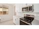 Modern kitchen with white cabinets, stainless steel microwave and oven at 18759 E Panchito Dr, Gold Canyon, AZ 85118