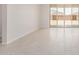 Open living area with light wood-look flooring and sliding glass doors at 18759 E Panchito Dr, Gold Canyon, AZ 85118