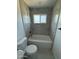Bathroom featuring a clean white bathtub, modern toilet and updated shower fixtures at 1915 W Missouri Ave, Phoenix, AZ 85015
