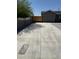 Spacious driveway with a wooden gate adding privacy to the home at 1915 W Missouri Ave, Phoenix, AZ 85015