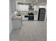 Modern kitchen featuring white cabinetry, stainless steel appliances, and an open layout at 1915 W Missouri Ave, Phoenix, AZ 85015