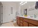 The bathroom includes a double sink vanity, decorative accents and a tile floor at 19585 W Washington St, Buckeye, AZ 85326