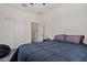 This bedroom features an attached bathroom, closet, and neutral wall color at 19585 W Washington St, Buckeye, AZ 85326
