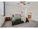 The spacious bedroom is carpeted and has an attached bathroom and decorative pillows at 19585 W Washington St, Buckeye, AZ 85326