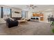 Spacious living room with modern ceiling fan, neutral paint, carpet, and open floor plan at 19585 W Washington St, Buckeye, AZ 85326