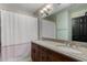 This bathroom has a dual sink vanity with granite counters, tile backsplash, and shower with curtain at 2149 E Hermosa Vista Dr, Mesa, AZ 85213