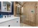 Bathroom featuring a glass-enclosed shower, modern vanity with storage, and updated fixtures at 2149 E Hermosa Vista Dr, Mesa, AZ 85213