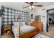 Bedroom showcasing light wood furniture, patterned accent wall, and rustic decor at 2149 E Hermosa Vista Dr, Mesa, AZ 85213