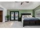 Bright primary bedroom featuring access to the patio, a ceiling fan, and plant decorations at 2149 E Hermosa Vista Dr, Mesa, AZ 85213