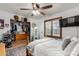 Light-filled bedroom featuring a walk-in closet and a window with wood shutters at 2149 E Hermosa Vista Dr, Mesa, AZ 85213