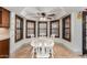 Bright breakfast nook with white table set in front of shuttered windows at 2149 E Hermosa Vista Dr, Mesa, AZ 85213