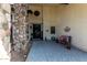 Inviting front porch with stone accents, decorative welcome sign, and cozy seating area at 2149 E Hermosa Vista Dr, Mesa, AZ 85213