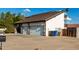 View of the three-car garage with stone accents and extra-long driveway at 2149 E Hermosa Vista Dr, Mesa, AZ 85213