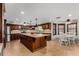 Gourmet kitchen features custom cabinetry, granite countertops, and view of the breakfast nook at 2149 E Hermosa Vista Dr, Mesa, AZ 85213