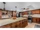 The spacious kitchen features a large island, stainless appliances, and custom wood cabinets at 2149 E Hermosa Vista Dr, Mesa, AZ 85213