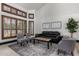 Bright living room with vaulted ceilings, shuttered windows, and elegant decor at 2149 E Hermosa Vista Dr, Mesa, AZ 85213