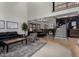 Spacious living room boasts tall ceilings, modern staircase, and lots of natural light at 2149 E Hermosa Vista Dr, Mesa, AZ 85213