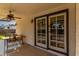 Covered patio with ceiling fan and glass doors to backyard at 2149 E Hermosa Vista Dr, Mesa, AZ 85213
