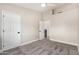Bright bedroom featuring soft carpet flooring and a double door entry at 220 N 22Nd Pl # 1022, Mesa, AZ 85213