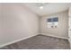 Cozy bedroom with neutral colors, carpet flooring, and a window providing natural light at 220 N 22Nd Pl # 1022, Mesa, AZ 85213
