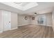 Spacious living room featuring modern lighting, hardwood floors, a ceiling fan, and sliding glass doors to the patio at 220 N 22Nd Pl # 1022, Mesa, AZ 85213