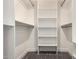 Walk-in closet with custom shelving, offering plenty of storage and organization at 220 N 22Nd Pl # 1022, Mesa, AZ 85213