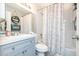 A modern bathroom featuring a vanity sink, mirror, and shower with subway tiles and a decorative curtain at 2301 E University Dr # 341, Mesa, AZ 85213