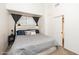 A cozy bedroom featuring a queen bed with a stylish headboard, black curtains, and neutral walls at 2301 E University Dr # 341, Mesa, AZ 85213