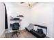 This bedroom includes a black futon, a desk, and a ceiling fan, perfect for relaxing and studying at 2301 E University Dr # 341, Mesa, AZ 85213
