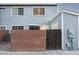 Charming home featuring a brick wall and gate, creating a private entrance and curb appeal at 2301 E University Dr # 341, Mesa, AZ 85213