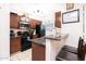 Updated kitchen with granite countertops and stainless microwave, with added seating for casual meals at 2301 E University Dr # 341, Mesa, AZ 85213