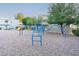 Colorful playground equipment amidst a well-maintained, community recreation area at 2301 E University Dr # 341, Mesa, AZ 85213