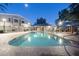 Community swimming pool with well-lit surroundings, ideal for evening relaxation and recreation at 2301 E University Dr # 341, Mesa, AZ 85213