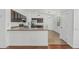 Eat-in kitchen features stainless steel appliances, a breakfast bar, and tile flooring at 2444 S Terrell --, Mesa, AZ 85209