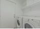 Laundry room with washer, dryer, and shelving for storage at 2444 S Terrell --, Mesa, AZ 85209