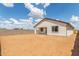 View of the backyard and exterior of the home with a block fence at 25332 N 133Rd Ave, Peoria, AZ 85383