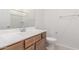 Bright bathroom featuring white sink and vanity with chrome fixtures at 25332 N 133Rd Ave, Peoria, AZ 85383