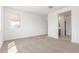 Neutral carpeted bedroom with a doorway and natural light from the window at 25332 N 133Rd Ave, Peoria, AZ 85383
