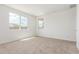 Well-lit bedroom featuring neutral carpet and windows with pleasant views at 25332 N 133Rd Ave, Peoria, AZ 85383