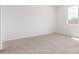 Bright bedroom with neutral carpet and a window letting in natural light at 25332 N 133Rd Ave, Peoria, AZ 85383