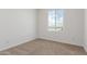 Bright bedroom with a large window overlooking a playground and blue skies at 25332 N 133Rd Ave, Peoria, AZ 85383