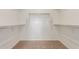 Spacious walk-in closet with ample shelving and neutral carpeting at 25332 N 133Rd Ave, Peoria, AZ 85383