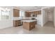 Modern kitchen featuring stainless steel appliances, wooden cabinets, and bright natural light at 25332 N 133Rd Ave, Peoria, AZ 85383