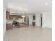 Spacious living room with ample natural light flowing into the connected kitchen space at 25332 N 133Rd Ave, Peoria, AZ 85383